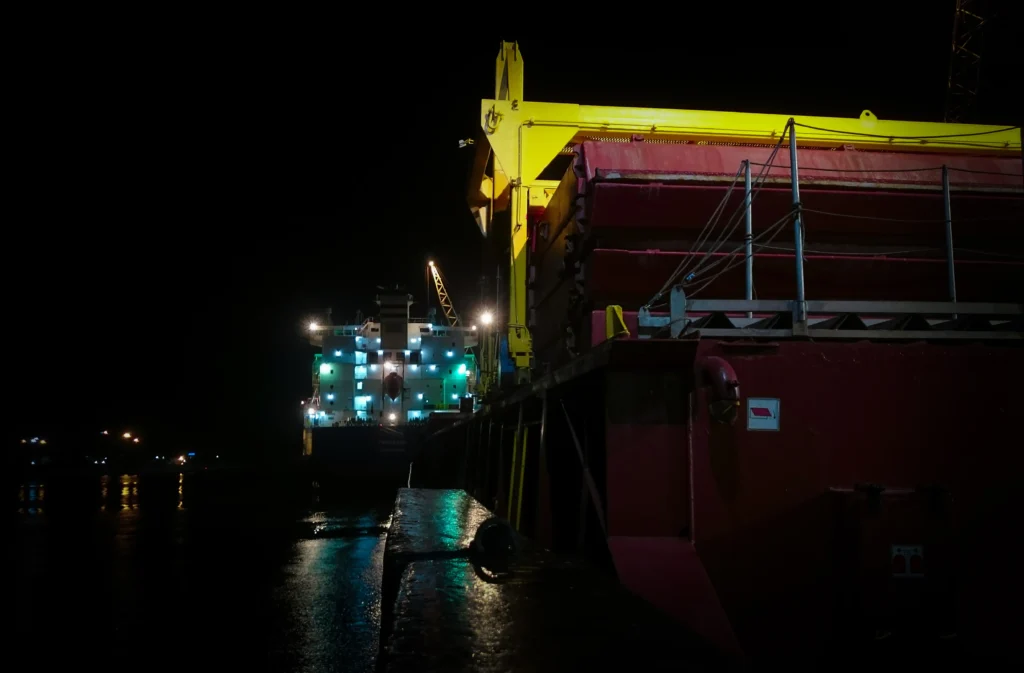 Industrial Ships and Barges Dockedat Night