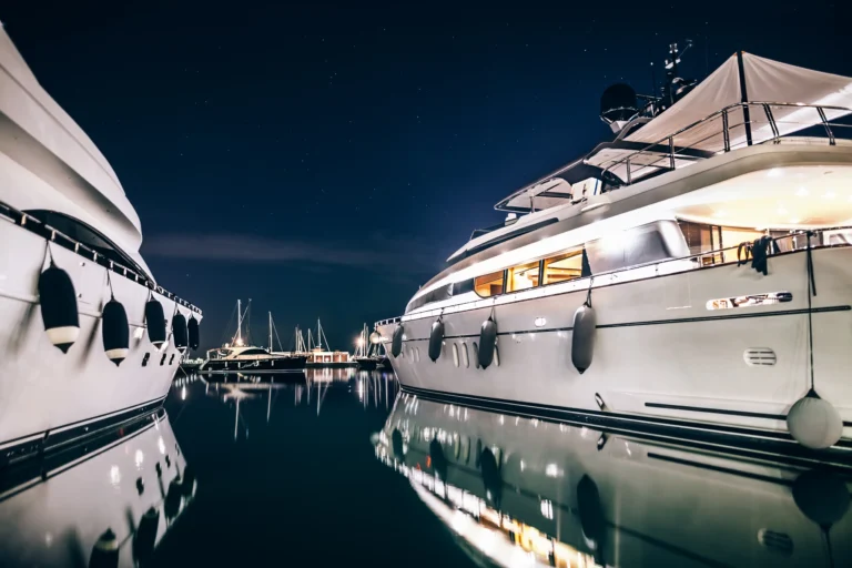 Luxury yachts in harbor at night with perfect yacht light solution